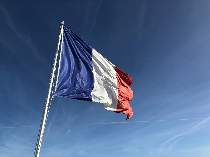 French flag under blue sky